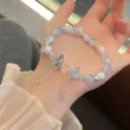Delicate blue crystal glass bead bracelet featuring a charming silver butterfly pendant detail. - Butterfly