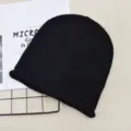 Solid color black knitted beanie hat, simple slouchy warm winter skull cap for daily wear. - Black