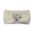 Cozy white knit headband featuring a sparkling rhinestone butterfly. Perfect winter ear warmer. - Beige