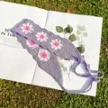 Knitted crochet headband with daisy floral pattern and ties, pastoral style hair accessory. - Purple