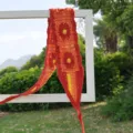 Gestricktes Häkel-Blumen-Stirnband orangefarbenes Lochmuster Tuch Damen Haarschmuck Sommer - Orangerot