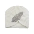 White knitted turban hat with sparkling rhinestone leaf brooch accessory for women. - Cream