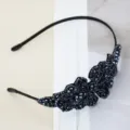 Close-up of black beaded crystal headband, elegant handmade design detail showing dark sparkling crystals. - Navy Blue