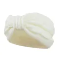 White knitted cable headband with warm fleece lining and bow accent for winter hair accessories. - White