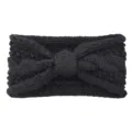 Black knitted bow headband, cozy winter ear warmer and stylish braided hair accessory. - Black