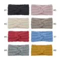 Detailed view of knitted twist headbands in multiple vibrant colors, showing the soft texture. - Multicolor