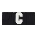 Black knitted headband with white letter C patch, stylish hair accessory for yoga sports. - Black