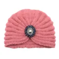 Close-up view of the pink knitted turban hat featuring a stunning crystal beaded brooch detail. - One Size / Dusky Pink