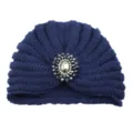 Close-up detail of the dark blue knitted turban hat with crystal brooch decoration. - One Size / Navy Blue