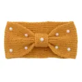 Detailed view of the knitted wool headband featuring elegant pearls and a chic bow knot design. - Turmeric