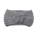 Grey knitted wool headband featuring a crocheted flower, stylish warm winter hair accessory. - Gray