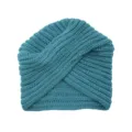 Detailed close-up of a blue-green knitted turban beanie featuring unique cross texture. - One Size / Post Green
