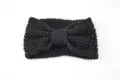Black knitted headband for women, cozy winter hair accessories and warm ear cover bow design. - Black