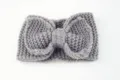 Grey knitted bow headband for women, stylish winter warm ear warmer hair accessory. - Medium Grey
