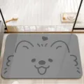 Detailed view of grey cartoon bathroom floor mat with cute dog face, absorbent and anti-slip. - Heart Dog / 40x60cm