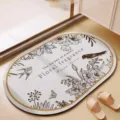 Close-up detail of vintage floral pattern absorbent floor mat in elegant home bathroom scene. - Oval Floral Everything