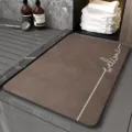 Detail view of brown diatomite bath mat featuring elegant welcome print and anti slip surface. - Minimalist Bath Mat 7