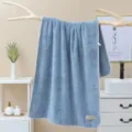 Soft solid color coral fleece bath towel with cloth label, highly absorbent and comfortable home use. - 70*140cm / Sky Blue