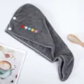 Grey coral fleece hair drying towel with cute buttons, quick dry absorbent hair cap variant. - Gray