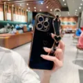 Electroplated heart phone case with luxury wrist strap for iPhone, soft protective cover. - Electroplated Hollow Heart + Blank Wristband / Classic Black / iPhone 14 Pro Max
