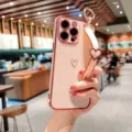 Electroplated heart phone case with wrist strap, soft TPU protective cover for iPhone. - Electroplated Hollow Heart + Blank Wristband / Cherry Pink / iPhone 14 Pro Max