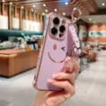 Electroplated purple phone case with cute smile pattern and wrist strap for iPhone 16 Pro Max. - iPhone 14 Pro Max / Lavender