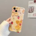 Detailed view of the aesthetic oil painting floral silicone phone case with wavy edge. - iPhone14 / Yellow Flower