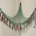Handmade macrame toy hammock corner net organizer with colorful ribbons for kids room wall storage. - Green
