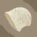 Detailed view of the beige handmade crochet knit bonnet, hollow out floral pattern cap. - Long Slouchy Hat