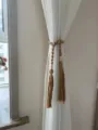 Boho macrame curtain tieback with wooden beads and tassels, woven cotton rope for home decor. - Coffee
