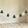 Close up detail of handmade crochet Christmas tree and snowflake garland hanging ornament. - 10cmX200cm / Green Christmas Tree