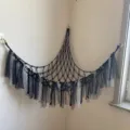 Black macrame toy hammock for kids room corner storage, handmade hanging net with tulle fringe. - Black Ribbon Style