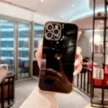 Detailed shot of electroplated black gold phone case with heart cutout design, premium grip. - For iPhone XR / Black