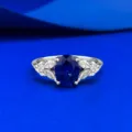 Detailed view of S925 silver created royal blue oval ring with elegant wing design jewelry. - Size 5 / R026 Royal Blue