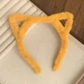 Detail view of the soft fluffy yellow cat ear headband for autumn and winter daily wear. - Cat Ear / Turmeric