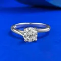 Stunning 1 carat round cut solitaire engagement ring in sterling silver with elegant four prong setting. - Size 5 / Silver