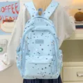 Light blue star print canvas backpack for school students with large capacity and multi pockets. - Blue