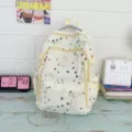 Large capacity canvas school backpack for students with stylish star pattern and multiple zip pockets. - Yellow
