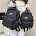 Japanese sweet style black school backpack with cute white bow and convenient front pockets. - L / Black