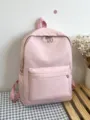 Zaino minimalista rosa con ampio scomparto principale, tasca frontale e tasche laterali. - Rosa