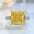 Close-up detail of a stunning yellow princess cut crystal ring with pave band sparkles. - Size 5 / Yellow
