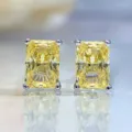 Strahlend geschliffene gelbe synthetische Diamant Ohrstecker Detailansicht funkelnd. - Gelb