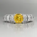 Detailed close-up of European style cushion yellow diamond ring, fine pave setting silver band. - Size 5 / Yellow