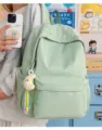 Detail view of a large capacity Japanese style school backpack in light green color for daily use. - With Pendant / Green