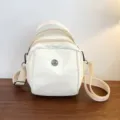 Casual white canvas shell shoulder bag with multi-zipper pocket and adjustable strap. - Standard / Light Yellow