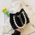 Black rhinestone bucket bag with large pearl handle and chain strap for women fashion style. - Black Pearl Style