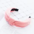 Pink knotted fabric headband detail shot, soft pleated texture, elegant everyday hair accessory - Pink