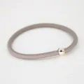Simple elastic hair band with metallic round bead, minimalist grey hair accessory style. - Khaki
