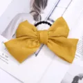 Coletero con lazo amarillo mostaza y banda elástica, accesorio de pelo elegante para mujeres. - Amarillo (Coletero)