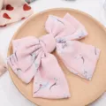 Chiffon floral hair bow clip detail view, elegant pink hair accessory for women and girls. - Premium Light Pink Floral